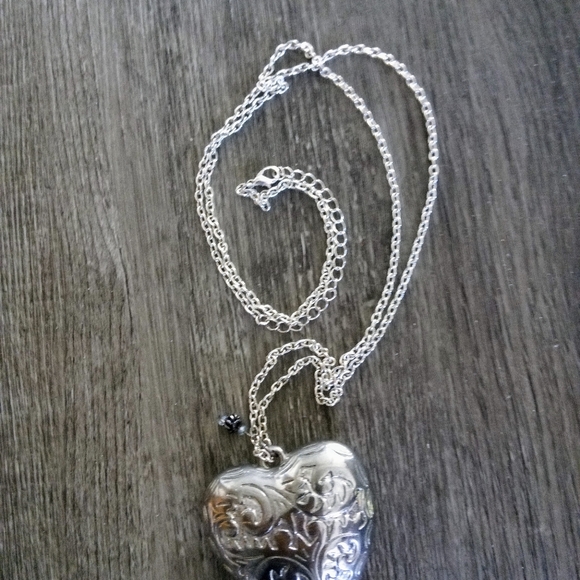 Oversized heart. Silvertone. 2"heart with 15" chain. $16.00 - Picture 2 of 6
